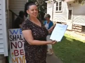 Cathy Lennon celebrates a judge's order allowing her to stay in her home