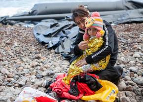 Refugees arrive by inflatable boat on the Greek island of Lesbos